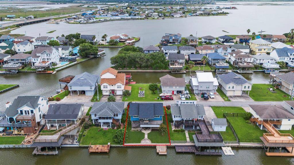 Nestled on the water with direct access to Omega Bay's network of canals connecting to Galveston Bay.