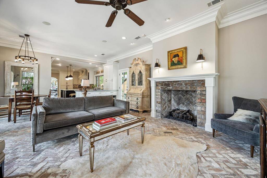 Framed by French doors and lush garden views, the family room offers an inviting escape.