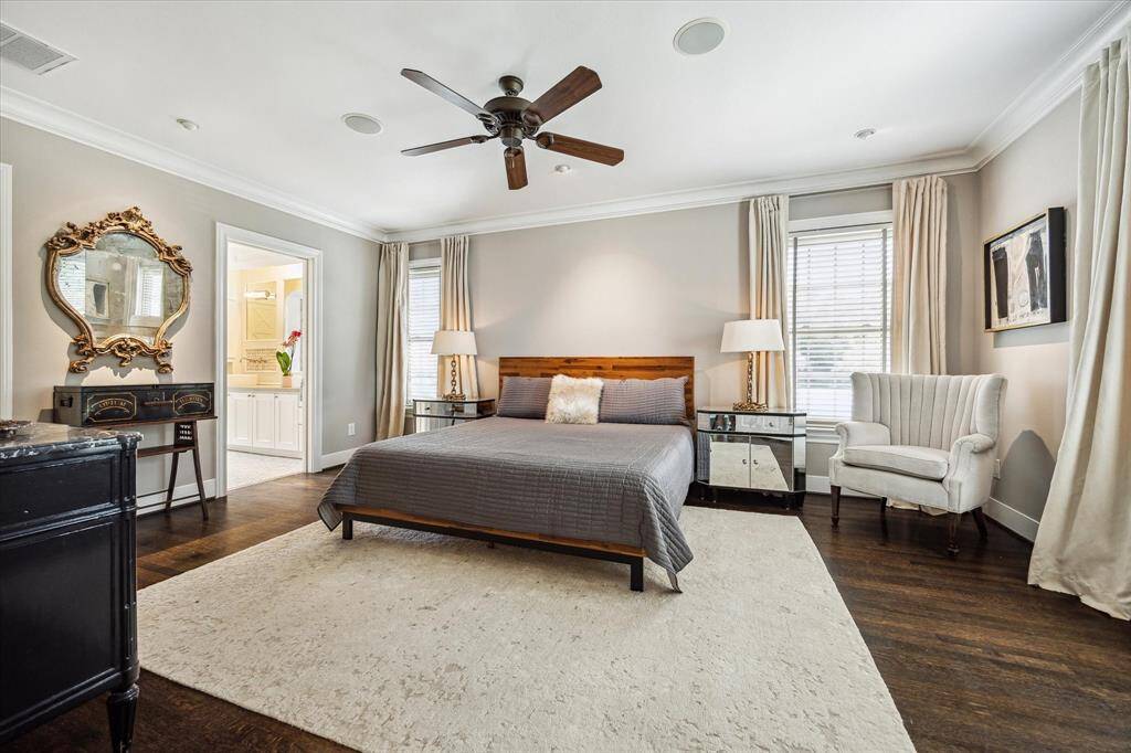 Retreat to the generous primary suite, complete with a luxurious white marble bathroom and an oversized walk-in closet.