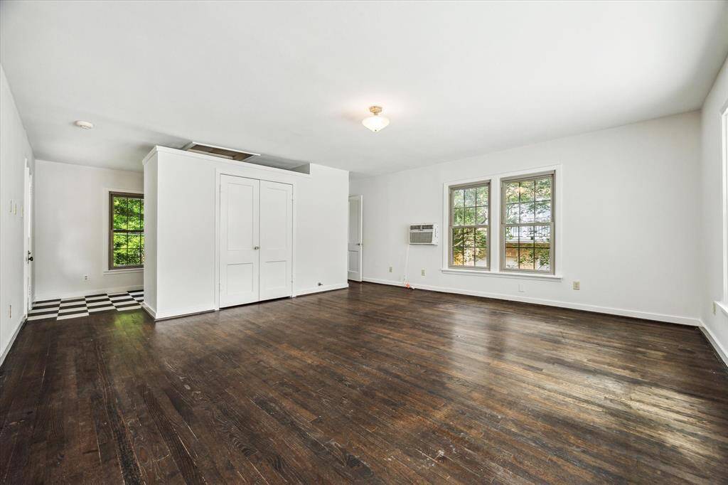 Positioned just off the former kitchen space, this generous room provides plenty of space for both sleeping and lounging, offering comfort and flexibility in one.