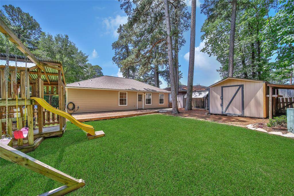 Spacious deck and patio area in the fenced backyard.(ai grass added, please see aerial view for actual grass coverage)