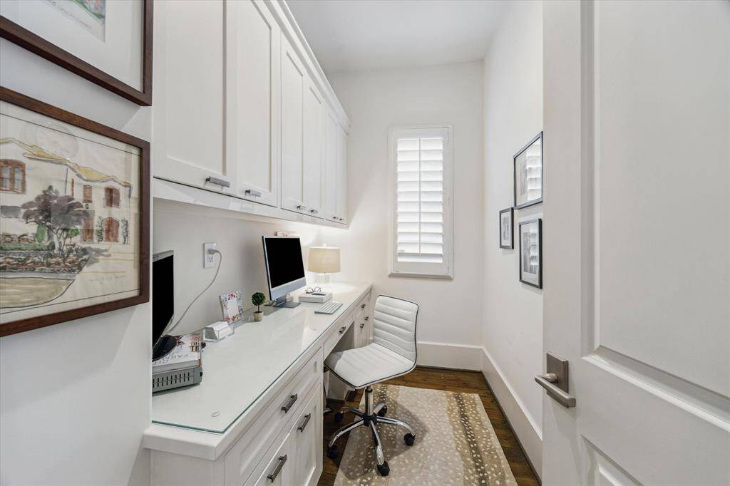 Private upstairs pocket office with built-in desk, storage, and natural light—ideal for work or study.