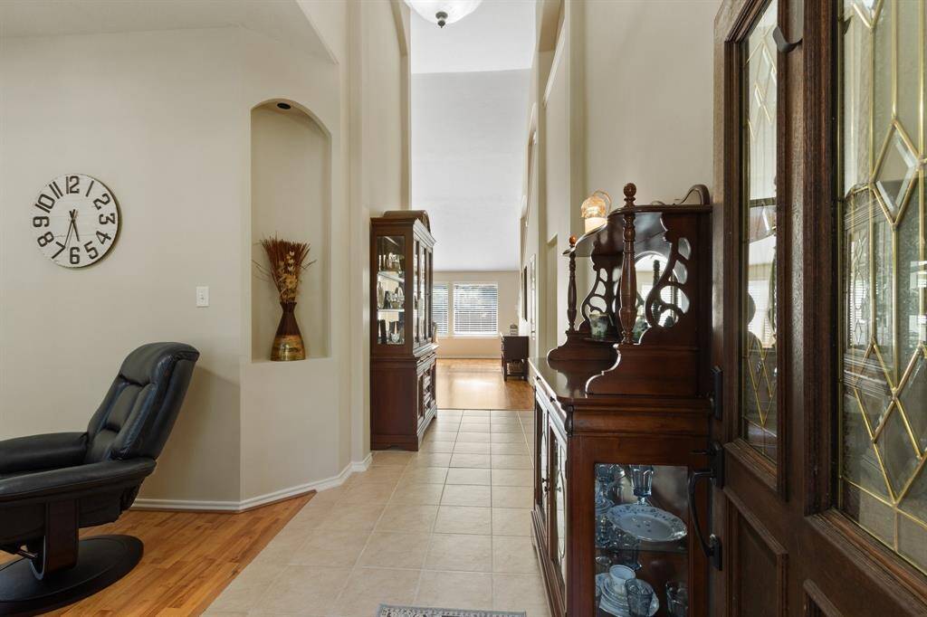 Stepping into the living area, you'll immediately appreciate the soaring ceilings and the expansive space, easily accommodating substantial furniture and large gatherings.