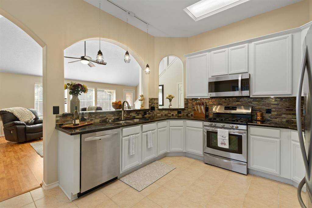 The family room is open to the kitchen and offers a comfortable space for family and friends.