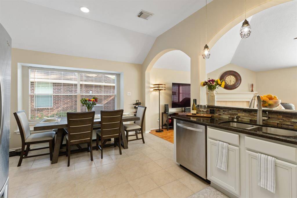 The attention to detail in the ceiling design, along with the generous infusion of natural light, adds a touch of elegance and warmth to this inviting space, making it truly noteworthy.