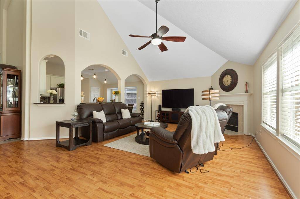 This bathroom features a large mirror, two walk-in closets, ample lighting and a large mirror.