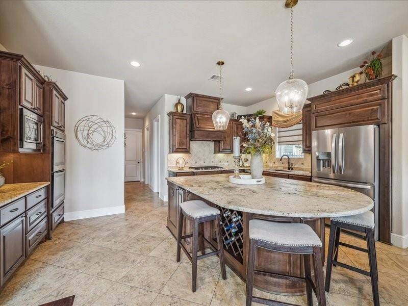 Notice the wine cabinet in the island.  Can you see you and your friends and family enjoying this kitchen?