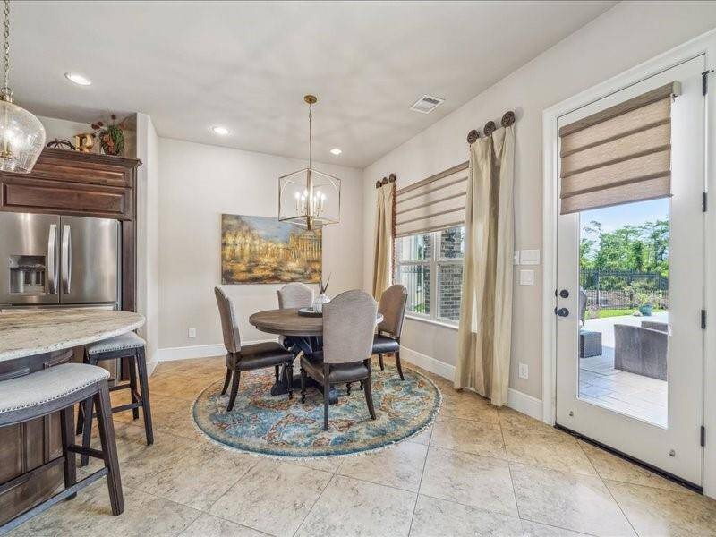 Large Breakfast area.  I want you to notice all the custom window coverings through out the entire home.