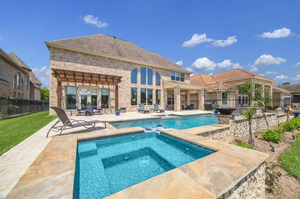 The gas firepit to the right also has a water feature.