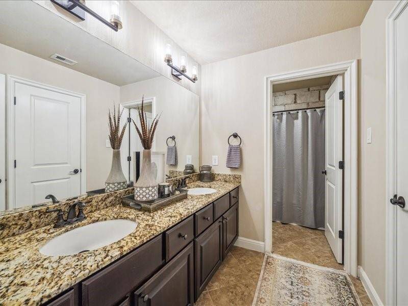 Another secondary bedroom has enough room for a seating area.