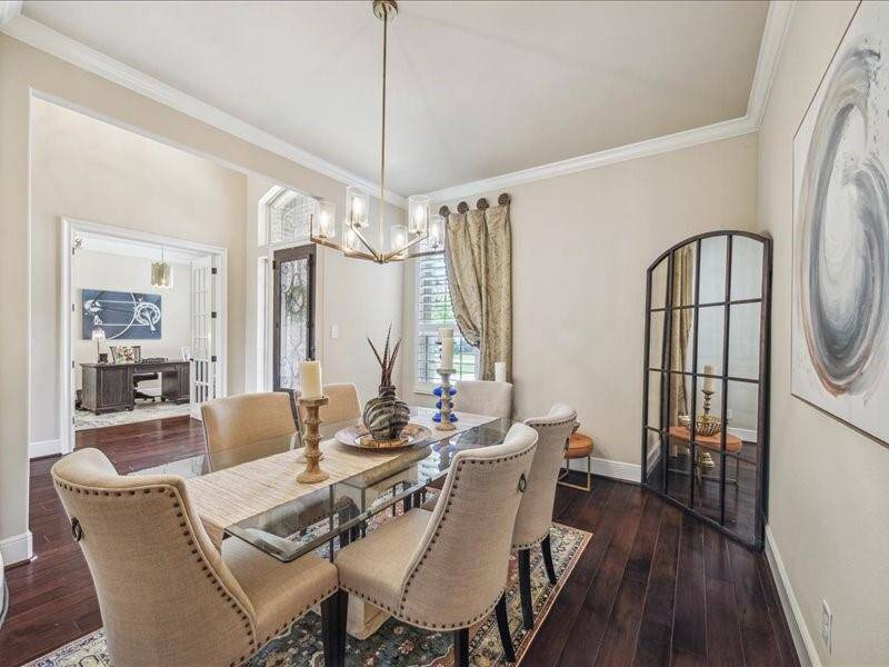 The large dining area greets your guest with class from the warm wood floors to the high end chandelier.