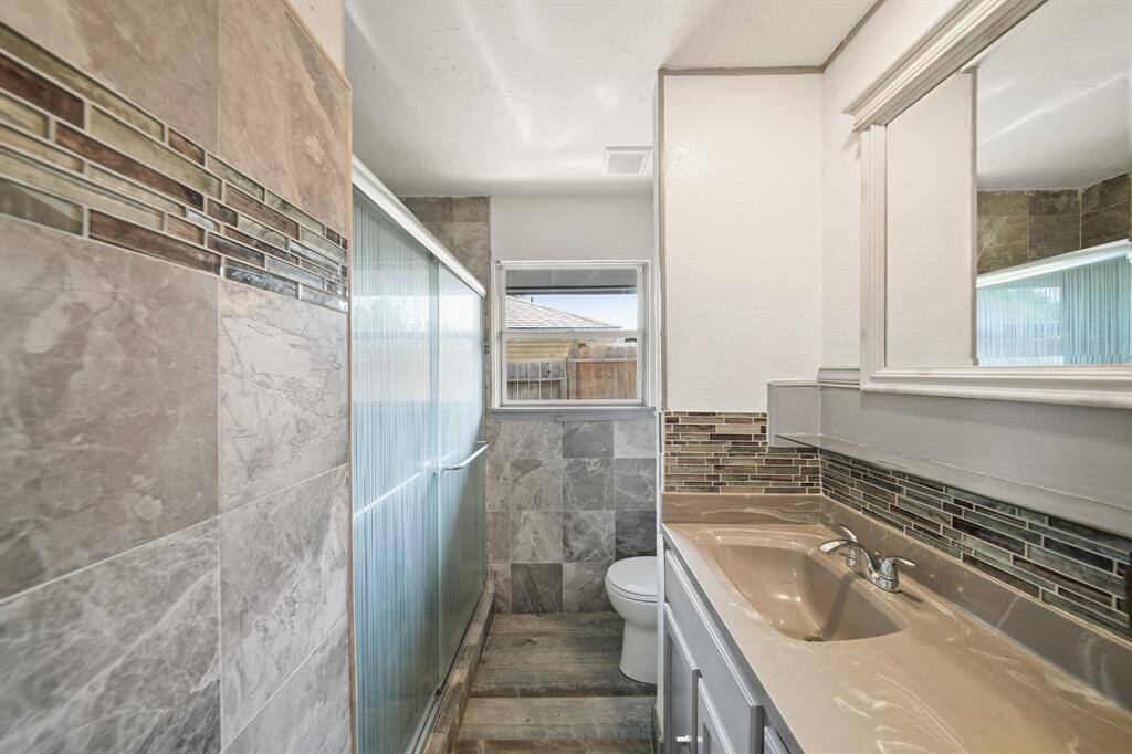 Fully renovated bathroom with walk in shower.