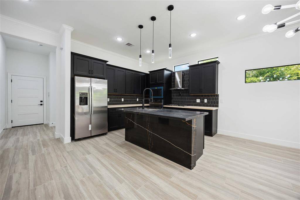 Bright open-concept kitchen flows seamlessly into the dining room.
