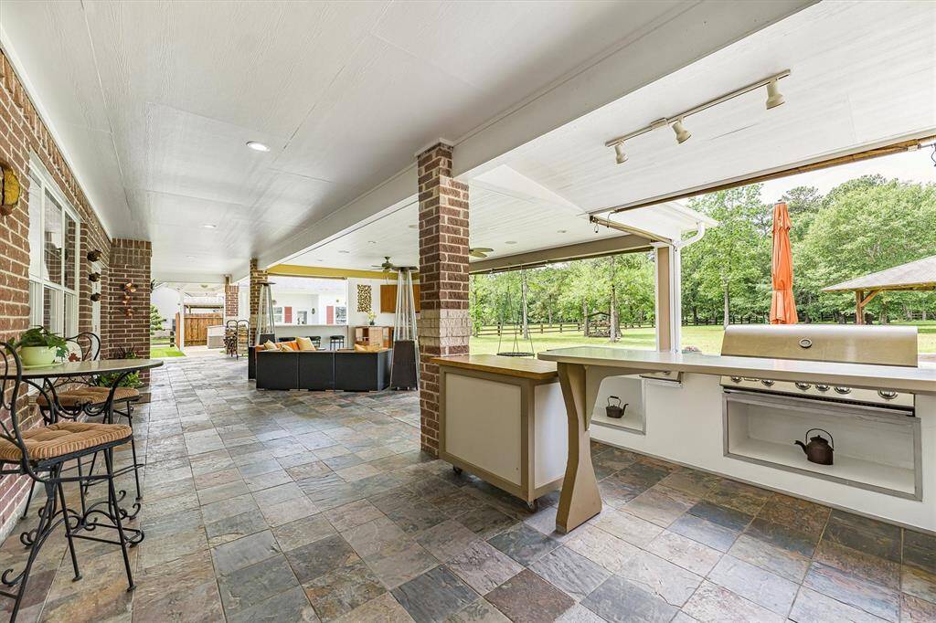 The huge covered back patio.  This is great for entertaining or just enjoying the day outside.