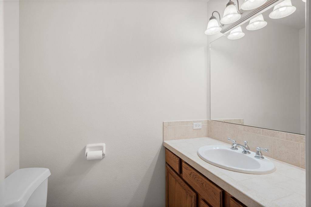 Functional bathroom with a single sink vanity.