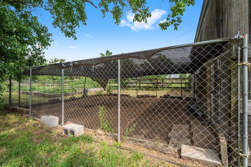 Dedicated fenced outdoor area, ideal for gardening or a secure pet enclosure.