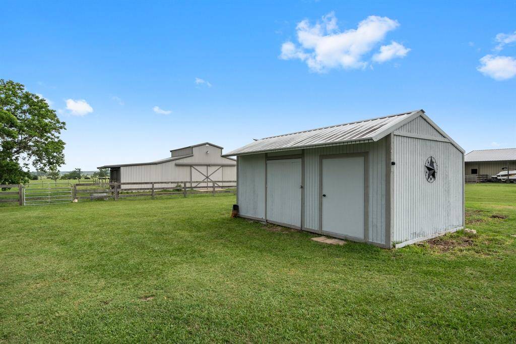 Property includes multiple outbuildings for additional storage and utility.