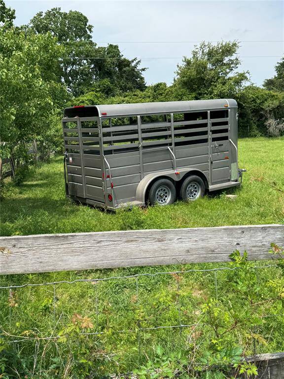 Livestock trailer included.