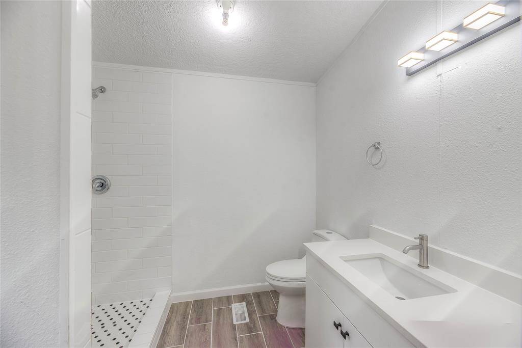 Updated bathroom with tile flooring.