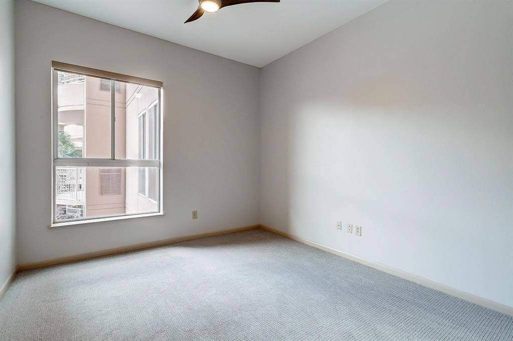 The bedroom is tucked away just off the living room and includes brand new carpet.
