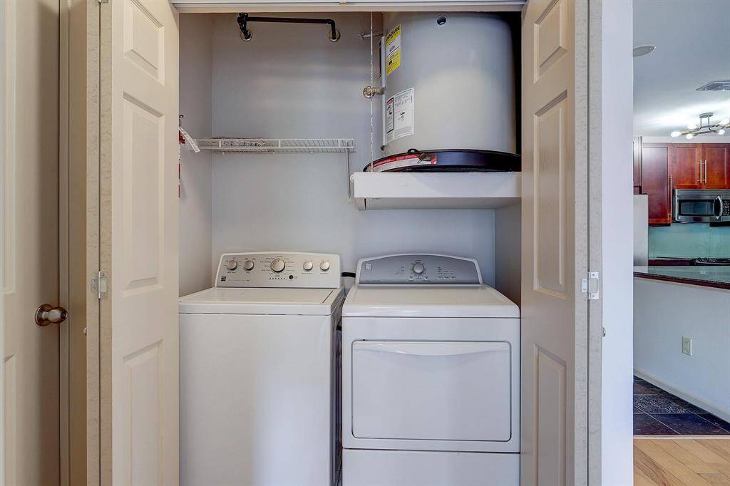 The utility space is conveniently located just outside the bedroom.