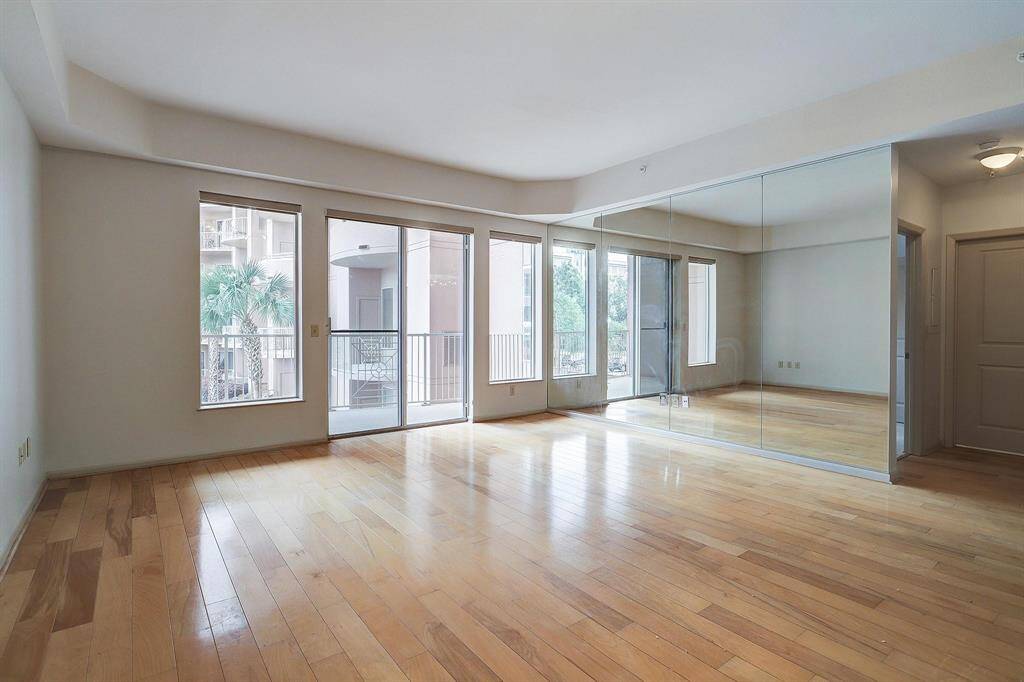 As you enter, you are greeted by an open living space with a copious amount of natural light.
