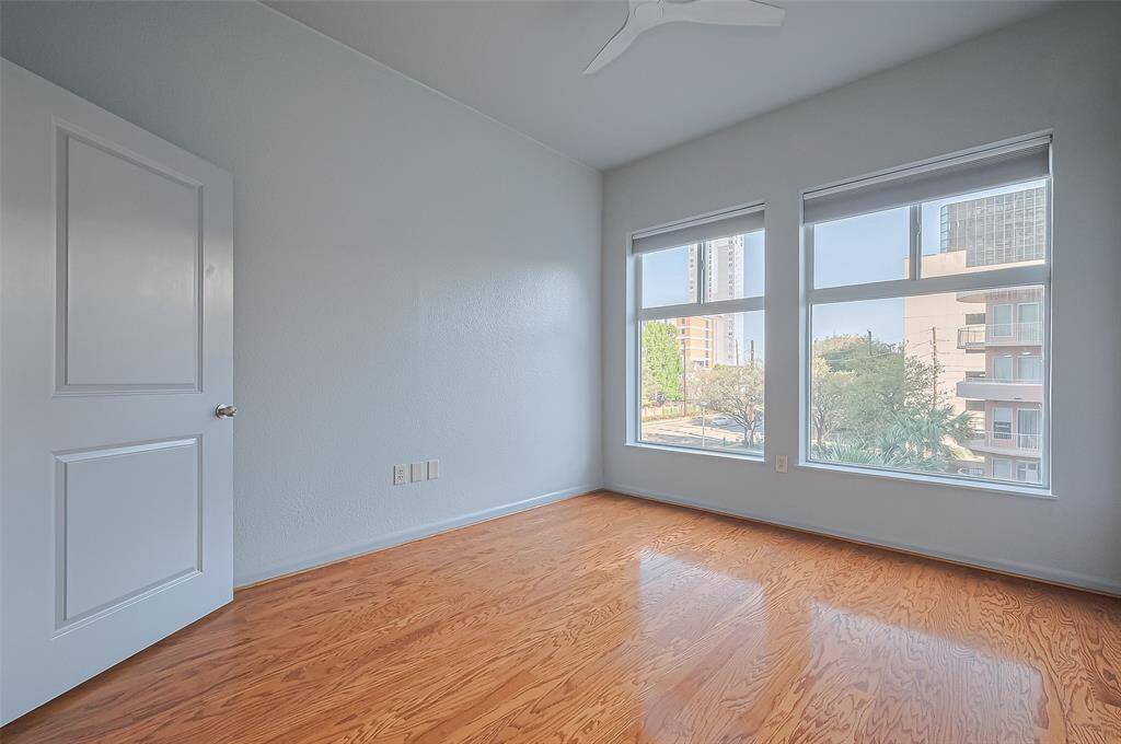 Bedroom with plenty of natural light over looking the pool.