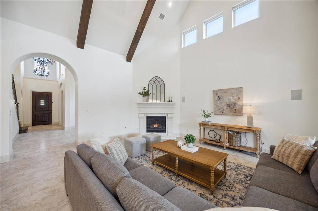 Vaulted Cathedral Ceilings and gas log fireplace are captivating in this open concept living space
