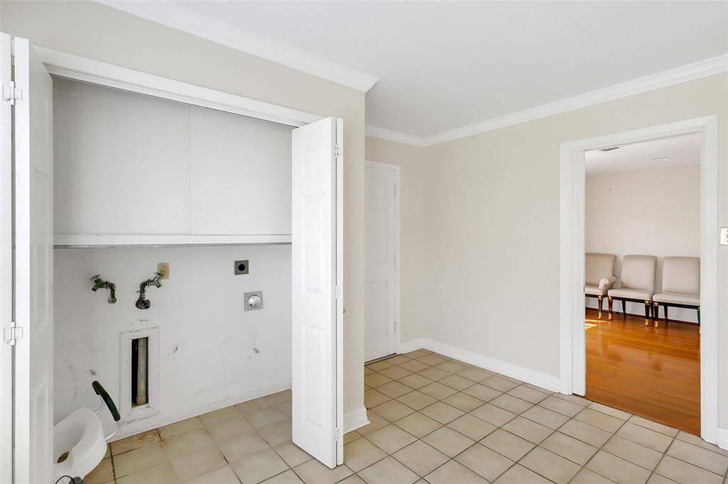 Here is the utilities closet opened up. The space will take a full-size clothes washer and dryer.