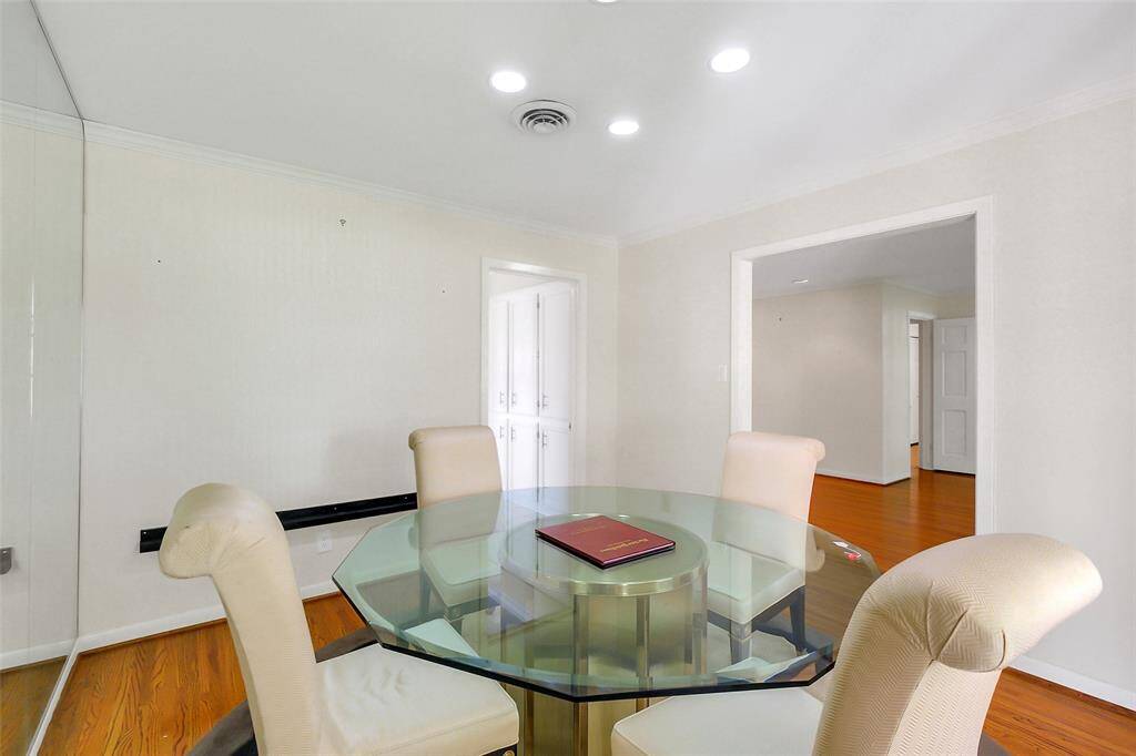 Another view of the formal dining room as facing back to the kitchen doorway to the left and then into the living area on the right.  This dining area can take a round, square, or rectangular table as needed.
