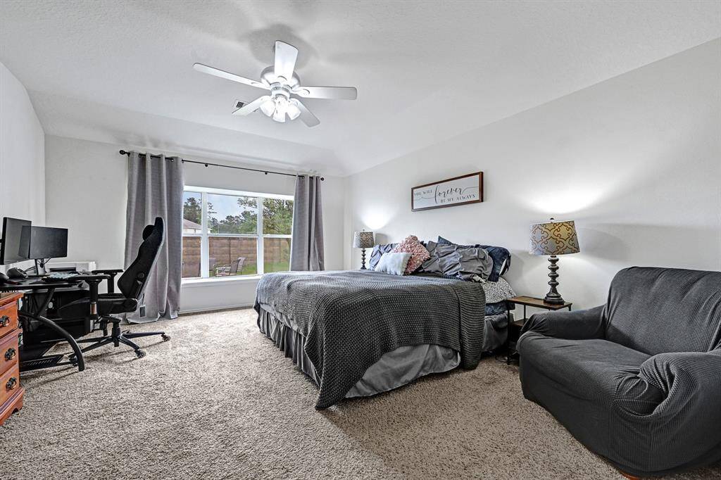 The spacious primary bedroom features another large window with window seat that allows for plenty of natural light to fill the room. You have to see this space in person to fully appreciate just how big it is!