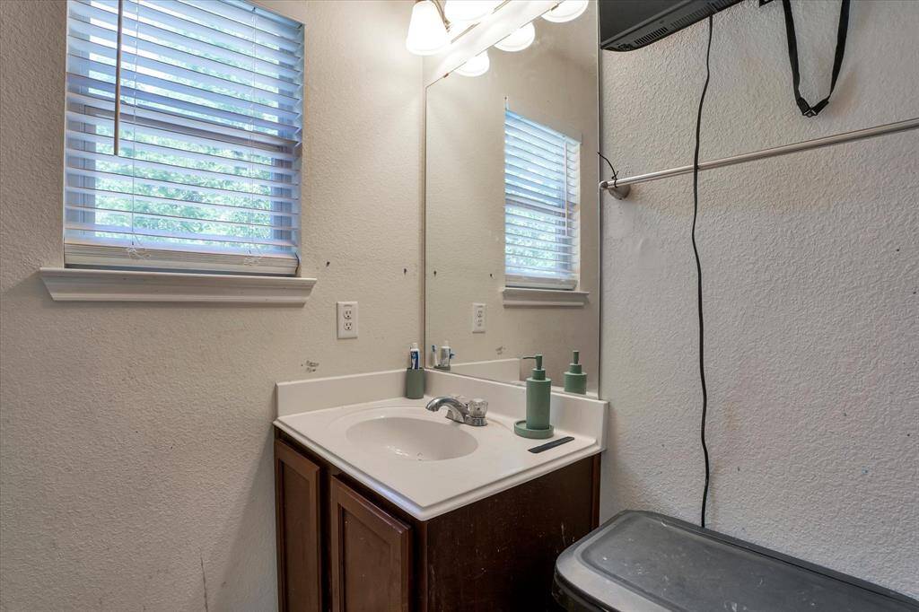 Conveniently located near the additional bedrooms, featuring a tub/shower combo and neutral finishes.