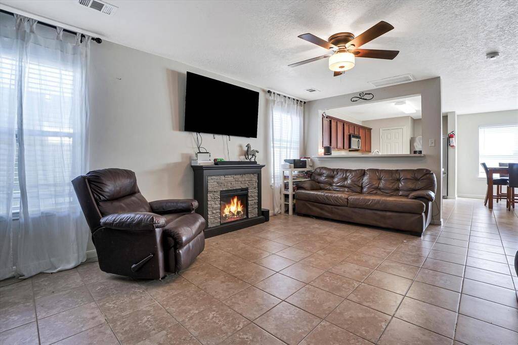 Spacious living area with plenty of natural light, perfect for relaxing or entertaining.