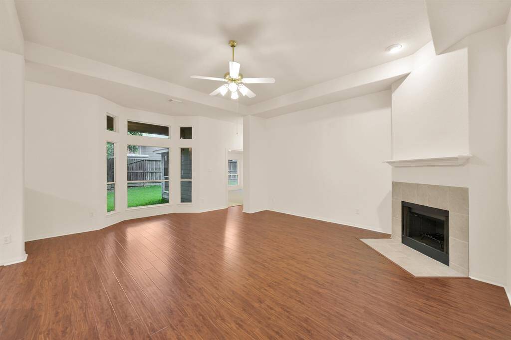 Spacious and open living room, with engineered wood flooring.