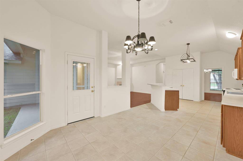 Breakfast room with a view into the kitchen.