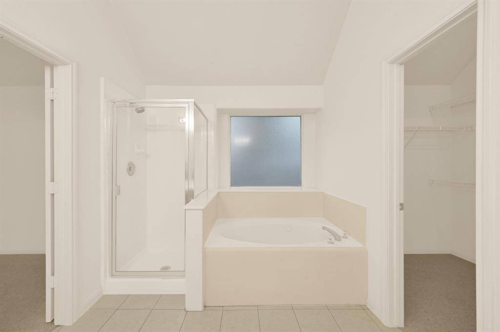 Both a large jetted tub and shower.