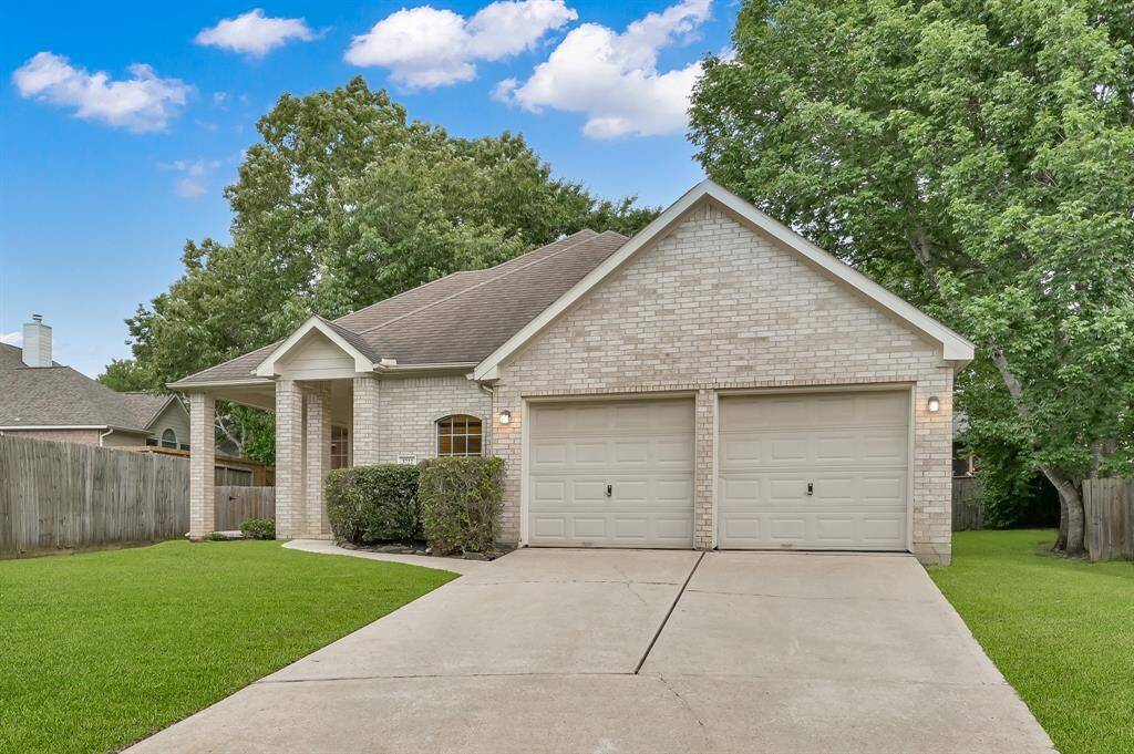 Beautiful established trees surround the home.