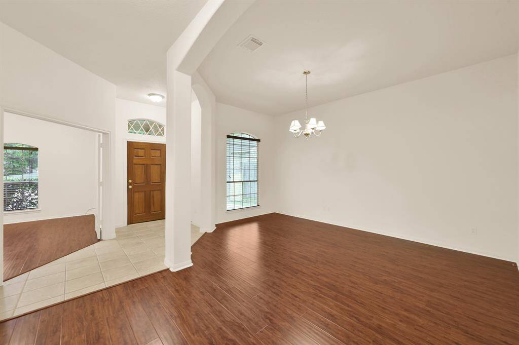 Front entry with the formal dining room on one side, and private study on the other.