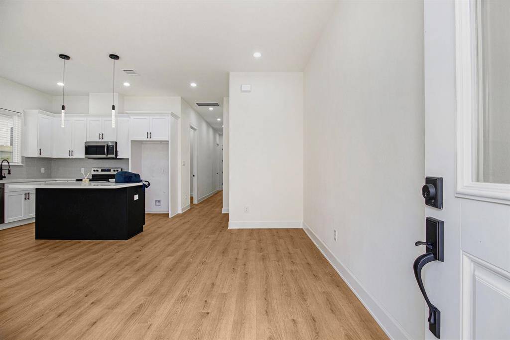Open layout with hardwood flooring