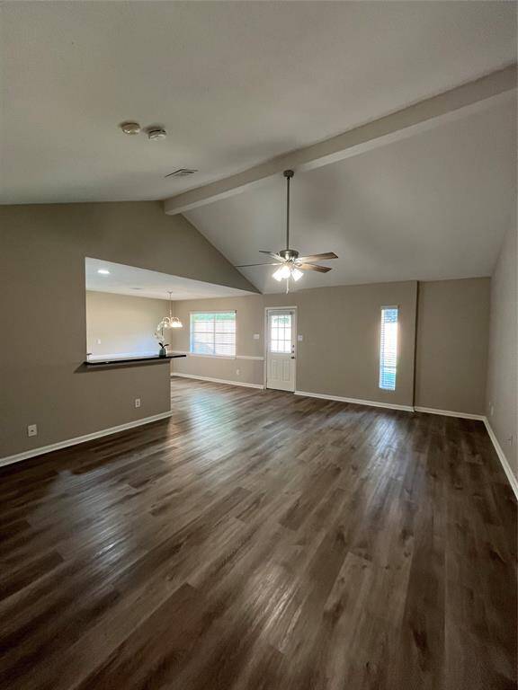 Spacious Living Room with ceiling fan.