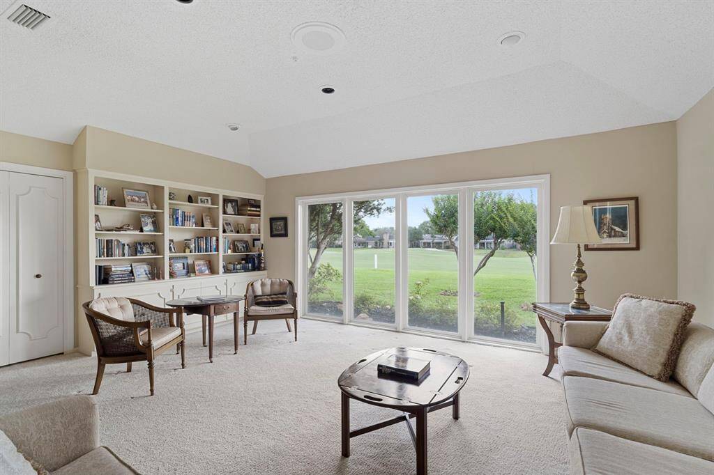Custom built-in cabinetry adds charm and function to this inviting space.