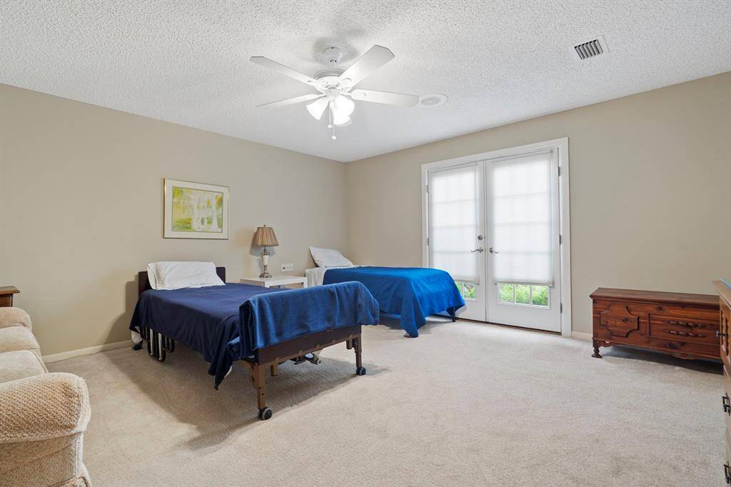 Each generously sized bedroom features large walk-in closets and private en suite bathrooms, offering comfort and privacy.