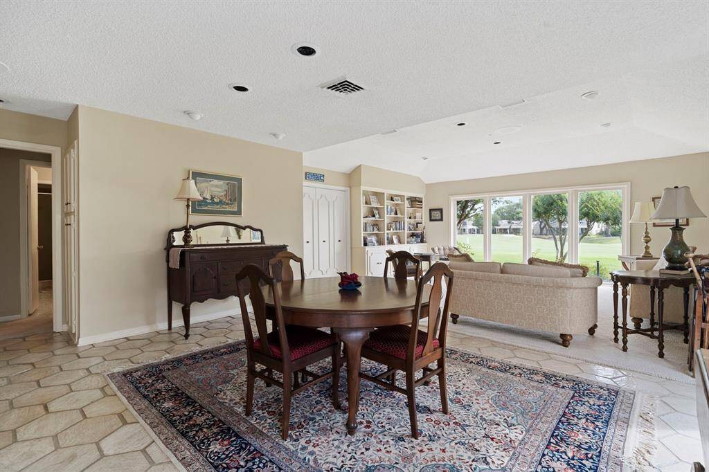 The formal dining area offers versatility to suit your lifestyle—perfect as an elegant space for entertaining or easily adapted into an additional sitting room.