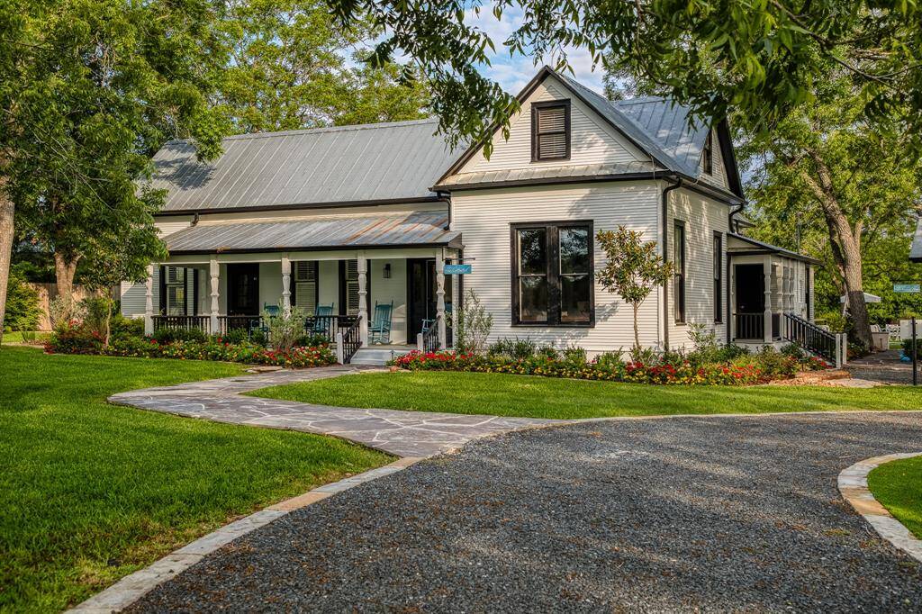 Set against the backdrop of Round Top's picturesque landscape, The Cotton Pearl stands as a testament to timeless Southern architecture. From the classic wraparound porch to the crisp black-trimmed windows, every detail reflects a thoughtful restoration that while embracing contemporary comfort.