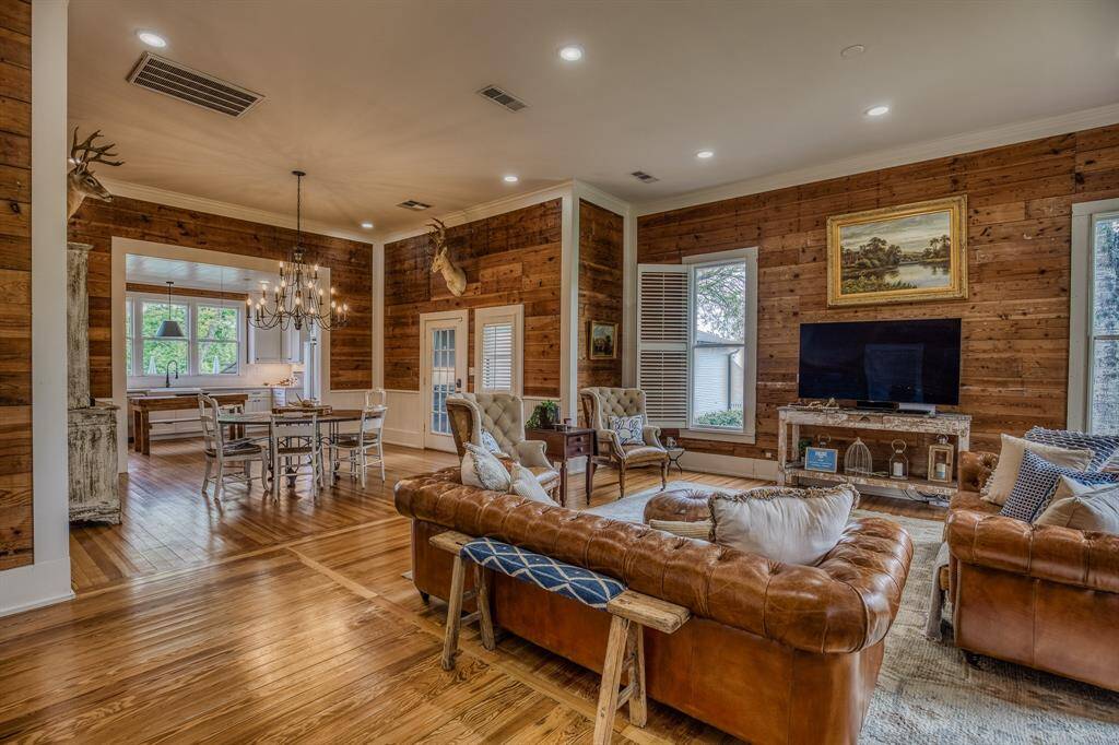 Open-concept living at its finest, this space was made for connection. From the living room to the dining area & into the kitchen, every detail—from wood flooring to natural light—supports the rhythm of everyday life with timeless ease.