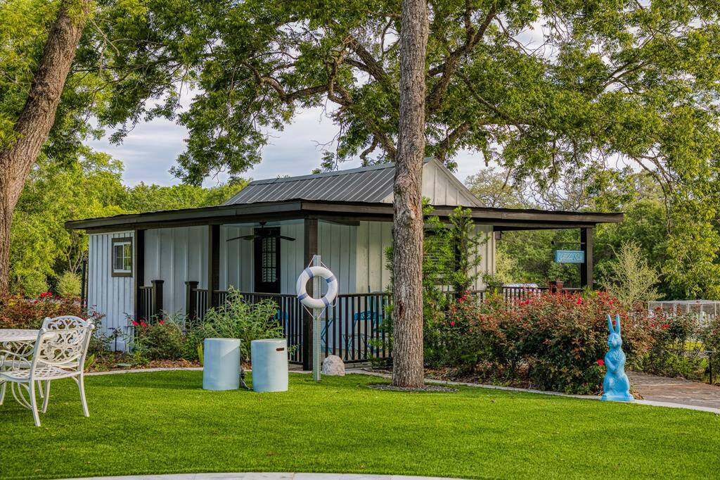 A storybook setting unfolds as you head to the Garden Suite with vibrant plantings, charming architectural lines, and whimsical touches that makes this a perfect retreat.
