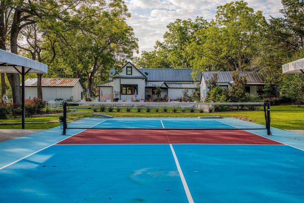 A closer look at the private pickleball court reveals a vibrant, thoughtfully designed space for play, connection, or friendly matches under the Texas sky.