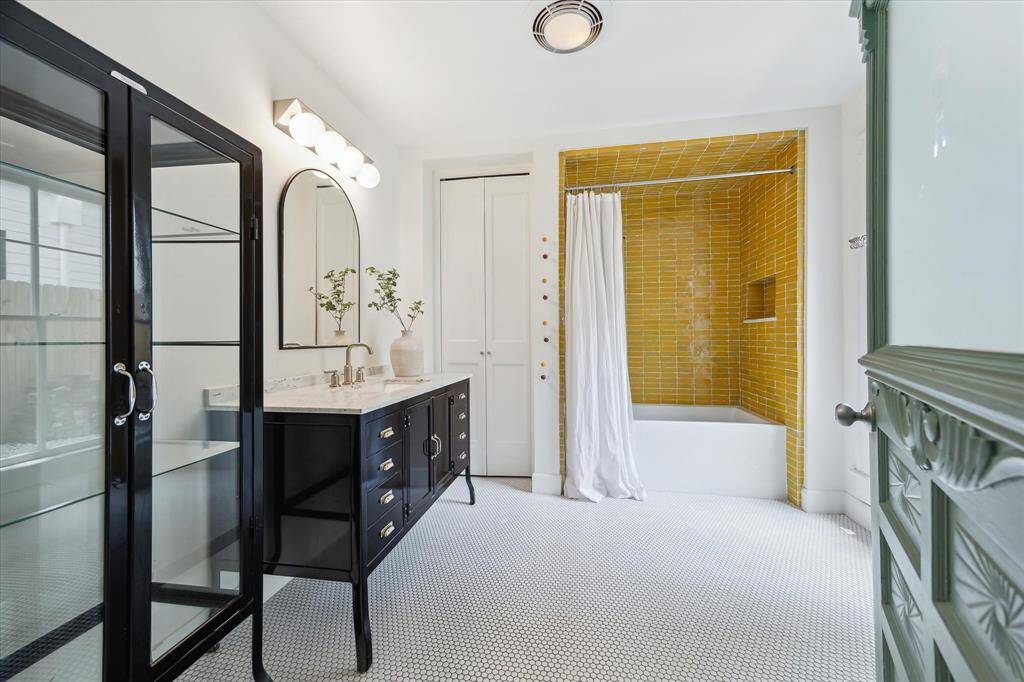 Full secondary bath fully remodeled in 2021. Updates include Restoration Hardware vanity, cabinet and hardware, Carrara marble counter top, Clé handmade Zellige shower tile, penny floor tile and large soaking tub/shower