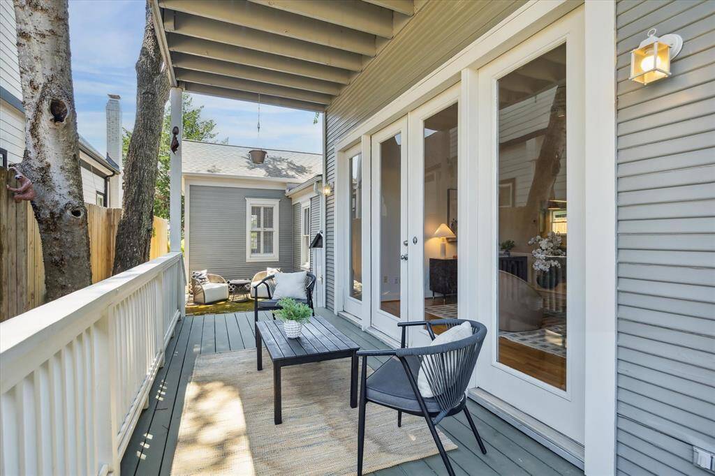 Covered patio off den. Railing added in 2024