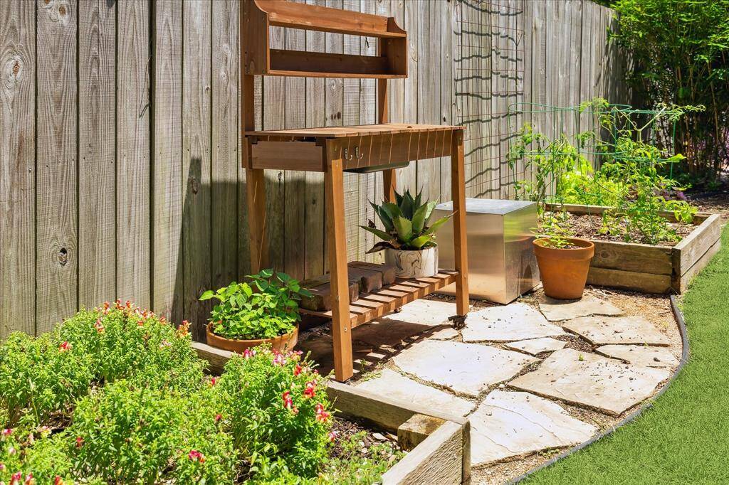 Custom square-raised beds surround the backyard